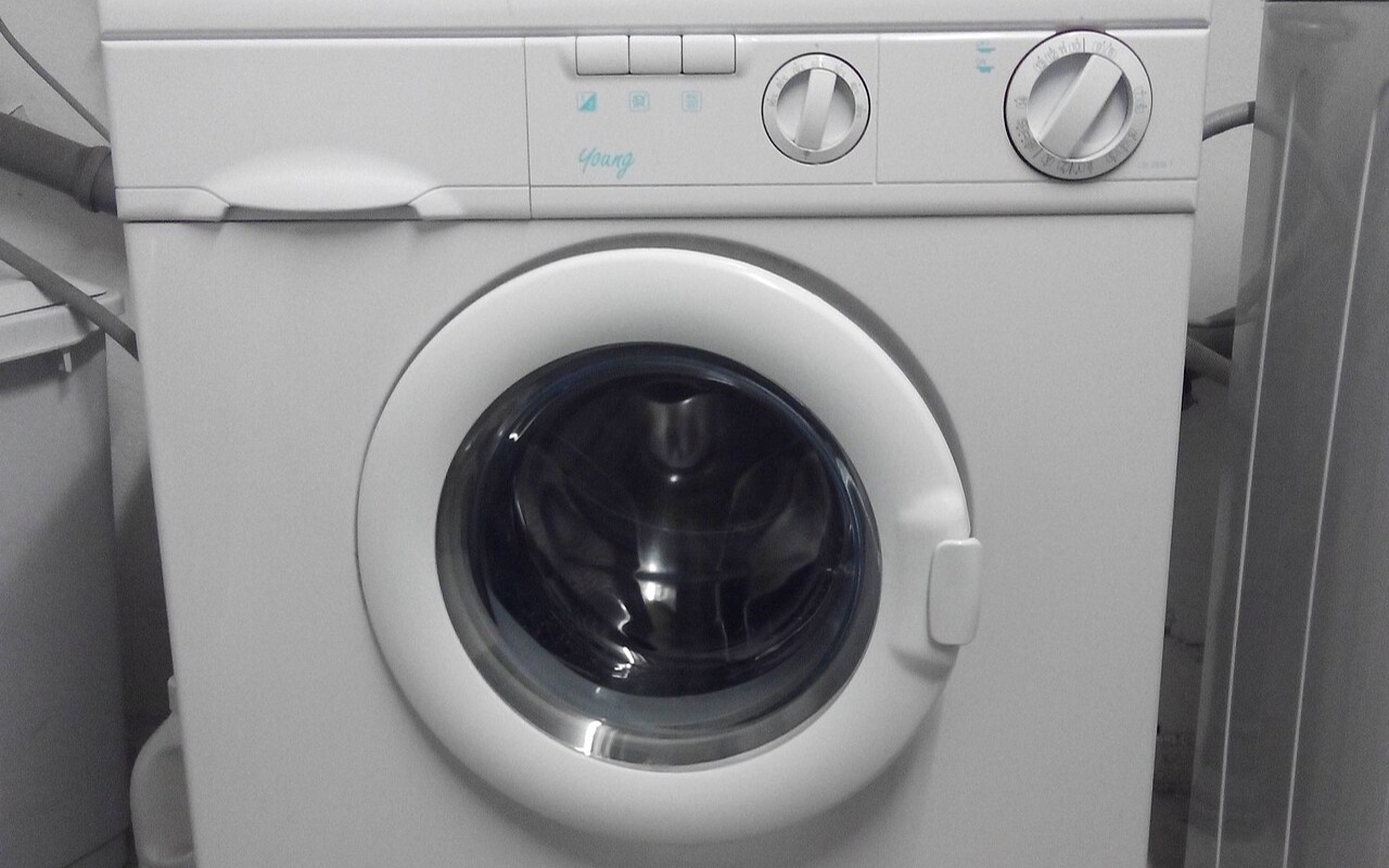 A domestic front-load washing machine in a German home