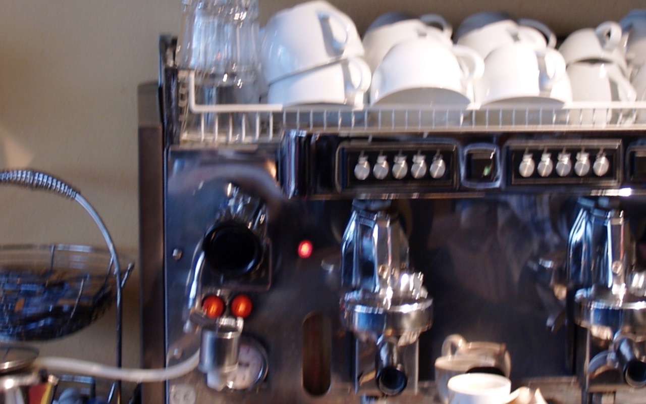 An espresso machine brewing coffee